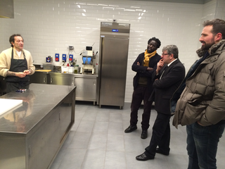 Intercultura - Capitolo 19 Un anno dopo: le attività fioriscono, Modou Gueye con Maurizio Stocchetto in visita alle cucine di Bar Basso, 2018