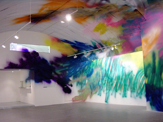 Katharina Grosse, If music no good I no dance, Infinite Logic Conference, 2004, acrylic on wall and objects, 388 x 2500 x 820 cm, Magasin 3 Stockholm Konsthall, Stockholm, photo: Mattias Givell, ©Magasin 3 Stockholm Konsthall/Mattias Givell