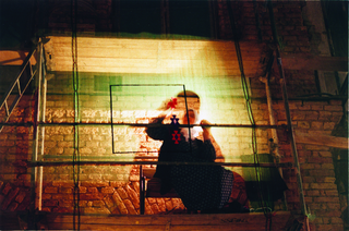 Maja Bajevic, Avanti Popolo, Maja Bajevic, Women at Work — Under Construction, 1999, five-day performance on the scaffolding of the National Gallery of Bosnia and Herzegovina / video (11’48”) / photographs.
Exhibition view: Under Construction, SCCA, Sarajevo, Bosnia and Herzegovina (Curator Dunja Blazevic), 1999.

Photo documentation: Haris Memija and Dejan Vekic