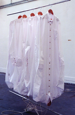 Maja Bajevic, Avanti Popolo, Maja Bajevic, SCH, 1995, installation, shirts, hangers, clothes rack, light bulbs, sound.
Exhibition view: ENSBA, Paris, France, 1996
