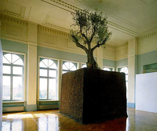 Maurizio Cattelan, Senza titolo, 1998
(Untitled)
Earth, olive tree
8 x 4 x 4 m
Manifesta 2, Casino Luxembourg, Luxembourg; Collezione del Castello di Rivoli - Museo d'Arte Contemporanea, Rivoli (TO)
