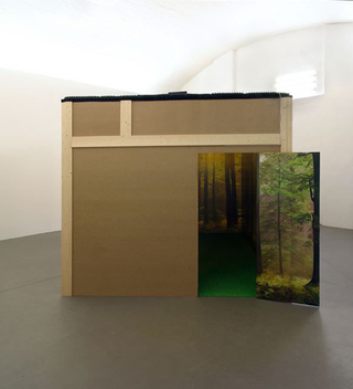 Liliana Moro, A Room with no View, 2004
Wooden structure, rubber-sponge, poster, neon light, moquette, sound
265 x 348 x 288 cm
Galerie Chouakri, Berlin
Courtesy: Galleria Emi Fontana, Milano 